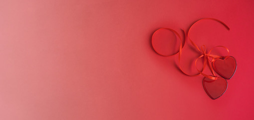 Two red hearts on red gradient background. Monochromatic effect. Love and Saint valentine Day modern concept. Copy space