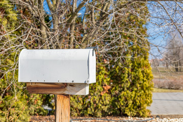 Old white post box, mailbox closeup in sunlight