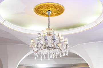 Vintage ceiling chandelier in white interior
