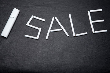 electronic smoke device dark leather background 