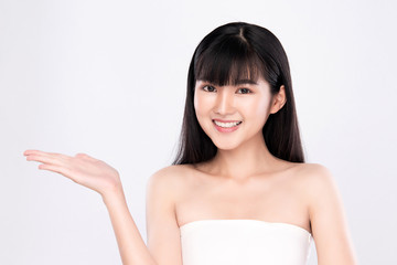 Beautiful Attractive Charming Asian young woman smile with white teeth open hand palm for display cosmetics product cheerful with healthy skin, on white background,Beauty Cosmetics Concept.