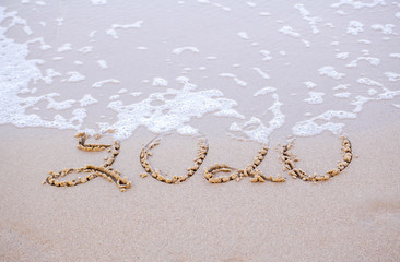 2020 writing in the sand  beach in the morning, appropriate the Backdrop idea copy space