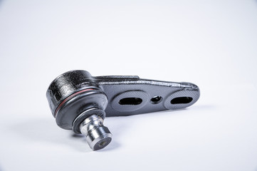 New spare parts spherical ball joints of a suspension bracket of a car on a gray background