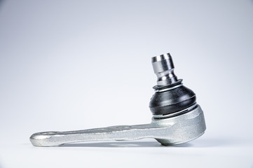 New spare parts spherical ball joints of a suspension bracket of a car on a gray background