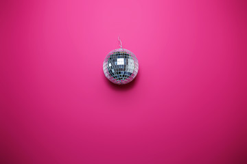 Saint Valentine's day card on pink background. Bright disco ball, colorful image, party theme.