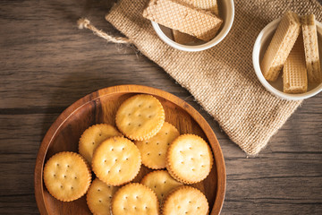 Dessert biscuit and cracker sweet food in coffee time put on the wood plate and wood table 