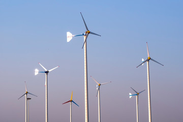 Wind turbine spinning for electricity production with blue sky