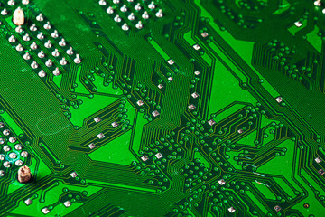 Green circuit board of a computer close up