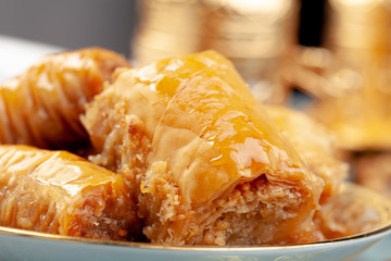 Stacked turkish baklava dessert in a plate close up