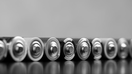 Finger batteries close-up. A set of finger batteries lying on the table. The concept of used...