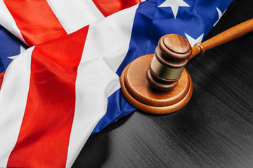 Judge gavel on the background of the flag united states of America