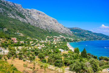 Obraz premium Barbati Beach with crystal clear azure water in beautiful landscape scenery - paradise coastline of Corfu island, Ionian archipelago, Greece.