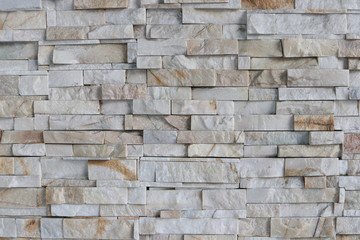 White and brown brick wall, rock brick background.