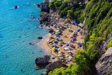 Mirtiotissa beach with crystal clear azure water and white beach in beautiful landscape scenery -...