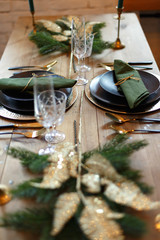Served festive Christmas table with dishes and decorations.