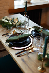 Served festive Christmas table with dishes and decorations.