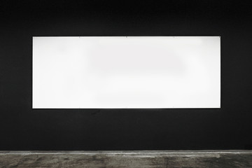 white banner on a black wall