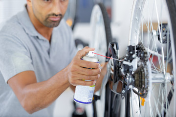 mechanic repaired bicycle in a workshop