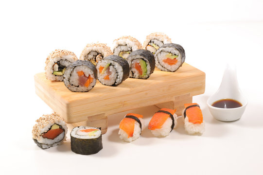 assorted of maki, sushi and rolls with salmon, shrimp and avocado- japanese sushi food
