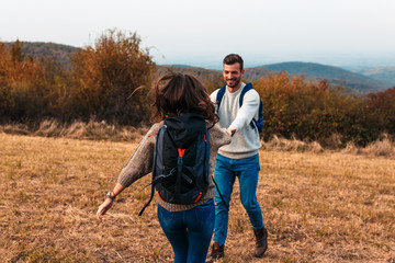 Young couple enjoying hiking together in nature.