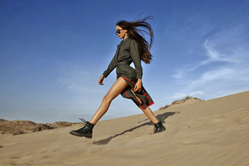 woman in the desert on the sand