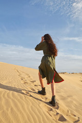 woman in the desert on the sand