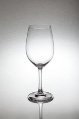 Glass wine glass stands on glass