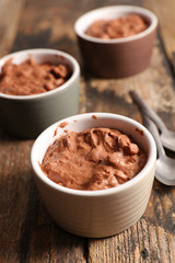 delicious creamy chocolate mousse on wood background