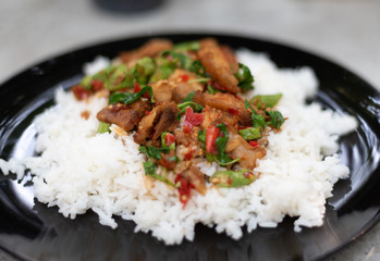 Stir Fried crispy pork with Red Curry and Basil leaves, Thai food