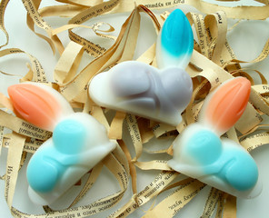 Handmade soap in the shape of rabbits on a white background.