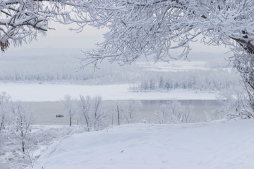 Winter landscape - view across the river to the opposite bank on