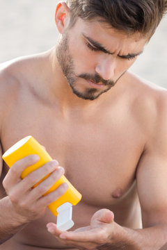 A Young Man Putting Sunscreen