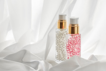 Skincare serum and make-up primer gel bottle, moisturizing lotion and lifting cream emulsion,...