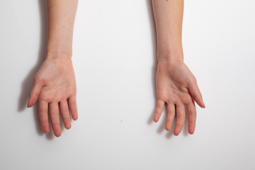 Kids hands palms out shot on white.