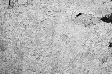 Texture of a concrete wall with cracks and scratches which can be used as a background