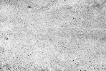 Texture of a concrete wall with cracks and scratches which can be used as a background