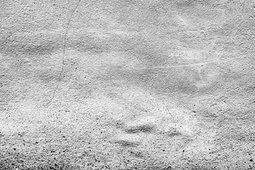 Texture of a concrete wall with cracks and scratches which can be used as a background