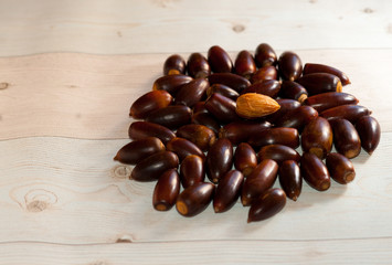 View on a group of brown corns in the light of autumn and lying on a wooden table.