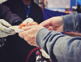 Vendor serving food to customer