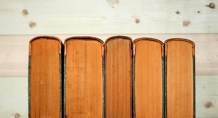 Collection of old books on wooden background