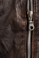 Old brown leather with a clasp, background and texture.