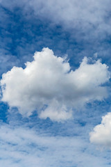 blue sky with a large white cumulus cloud as a natural background