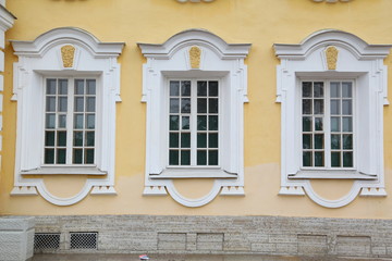 Palace window on yellow wall 