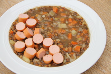 delicious freshly made lentil soup with a sausage