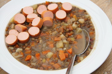 delicious freshly made lentil soup with a sausage