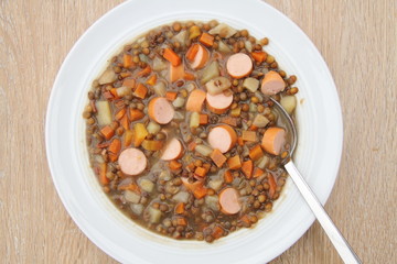 delicious freshly made lentil soup with a sausage