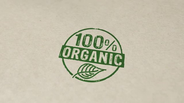 100 percent organic stamp and hand stamping impact animation. Ecology, bio, natural and healthy diet 3D rendered concept.