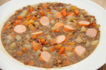 delicious freshly made lentil soup with a sausage