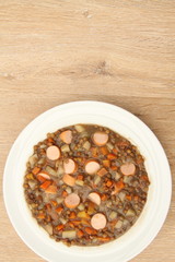 delicious freshly made lentil soup with a sausage