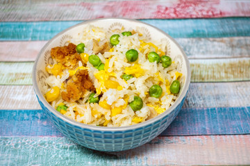 Homemade Chinese fried rice with vegetables and fried eggs